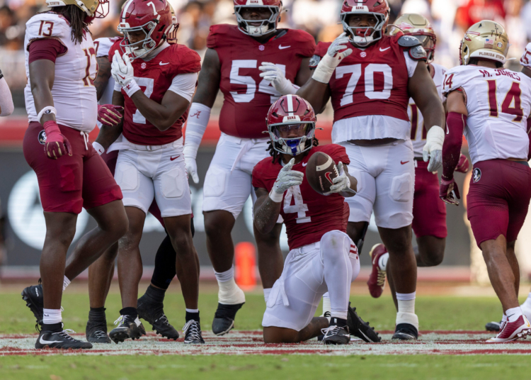 Alabama running back Daniel Hill (4) signals first down after his run against Florida State during the first half of an NCAA college football game Saturday, Sept. 19, 2026, in Tuscaloosa, Ala. (AP Photo/Vasha Hunt)