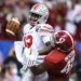 NEW ORLEANS, LA - JANUARY 01: Cardale Jones #12 of the Ohio State Buckeyes in action against Xzavier Dickson #47 of the Alabama Crimson Tide during the All State Sugar Bowl at the Mercedes-Benz Superdome on January 1, 2015 in New Orleans, Louisiana. (Photo by Streeter Lecka/Getty Images)